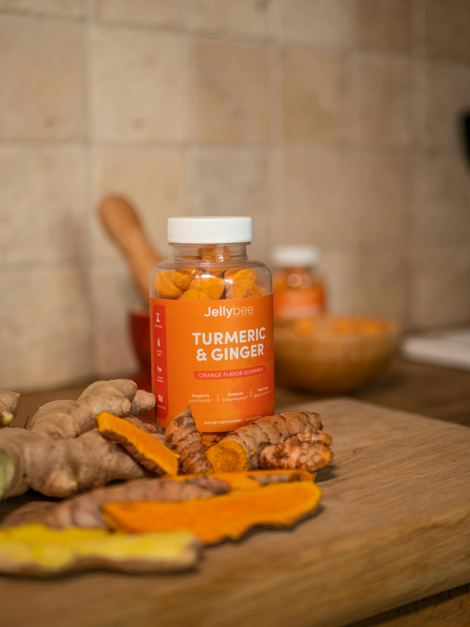 Close-up of Jellybee turmeric and ginger supplement gummies bottle.